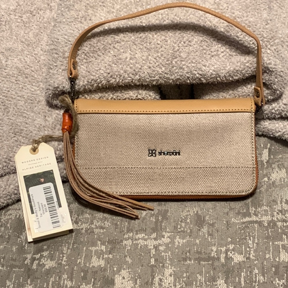 Very chic natural wristlet by Sherpani